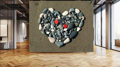 Stone heart on beach sand Wall mural