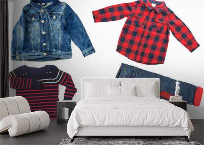 Top view on child boy set of clothes. Collage of apparel clothing. Jeans ,shirt and jeans jacket isolated on a white background. Jeans and t-shirt fashion. Wall mural