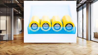 Yellow rechargeable batteries in the blue box Wall mural