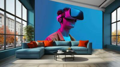 Young man embraces VR headset for futuristic experience. Wall mural