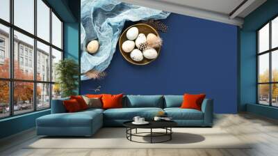 Easter banner with painted eggs and napkin on dark blue backround. Top view, flat lay with copy space. Wall mural