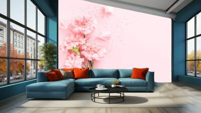 Pink carnations on pink background with confetti. Wall mural