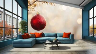 Christmas tree branch with red bauble and golden shimmering background. Festive holiday decoration. Wall mural