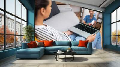 Female doctor demonstrating medication to a patient over a video call, exemplifying modern telemedicine practices. Wall mural