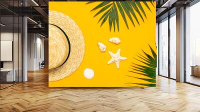 Women s summer straw hat, tropical palm leaves, monstera leaf, shells, starfish on yellow background top view flat lay copy space. Summer travel vacation concept. Female accessory, summer Wall mural