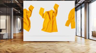 Yellow orange flying women's autumn knitted sweater on light gray background. Creative clothing concept, trendy fall winter cozy sweater pullover jersey. Women's fashion, autumn discounts. Shopping Wall mural