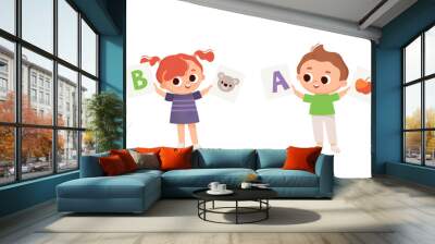 Two Kids, boy and girl holds leanning flashcards. Kids with english flashcards. Cards with letters. Learning English. Wall mural