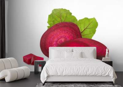 Red beet pieces and beetroot leaves isolated on white background as design for packaging Wall mural