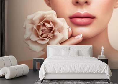 Beautiful model with a rose. Perfect woman face makeup close up. Lipstick. Beautiful nails Wall mural