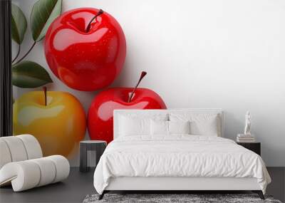 Three apples, one yellow and two red, are on a white background. The apples are surrounded by green leaves, which add a touch of nature to the scene. Concept of freshness and health Wall mural