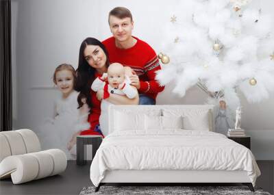 Happy family at home at Christmas with a Christmas tree Wall mural