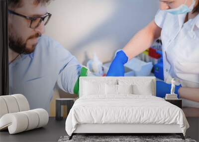 Nurse takes a blood test. Wall mural