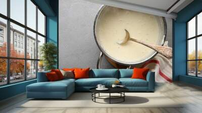 Bechamel sauce in saucepan Wall mural