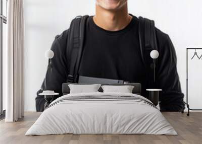 french student young 18 years old smiling with a back pack and a book on his hands wearing black casual clothes. On a white background.  Wall mural