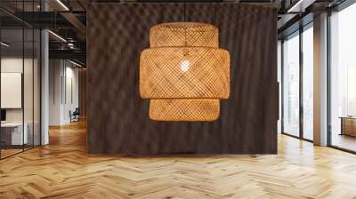 modern wicker lamp chandelier, lampshade design light. Local shaped lamps on ceiling on dark background Wall mural