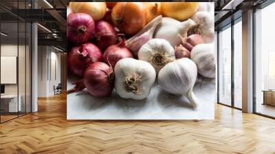 On a white background, there are two varieties of onions and garlic.. Wall mural