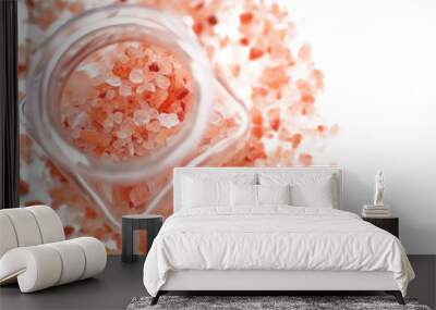 Pink Himalayan salt in a jar on a white background. Big crystals in glass pot for kitchen and beauty Wall mural