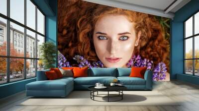 Female beauty portrait. Red-haired girl with healthy hair. The concept of fashion, beauty, cosmetics and care Wall mural