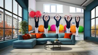 Little kids dance in dance class. The concept of sport, education, childhood, hobbies and dance. Wall mural