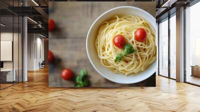 white ceramic bowl with pasta and red tomato on brown wooden table Wall mural