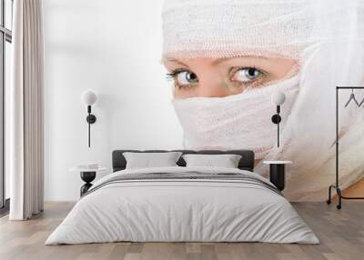 woman with bandages on her face closeup on white Wall mural