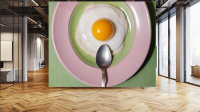 Conception of fertilization. Fried egg in white plate, and spoon Wall mural