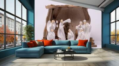 A nativity set depicting the three wise men visiting Jesus set against a clean white background Wall mural