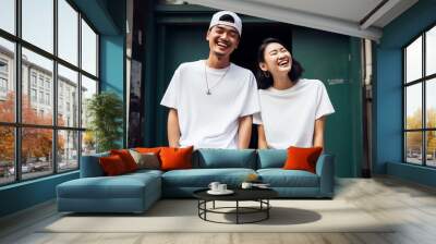 portrait of a happy couple laughing in the city, asian young people, outdoors, wearing fashion casual white streetwear, tshirts, cap, necklace, cheerful upbeat relationship Wall mural