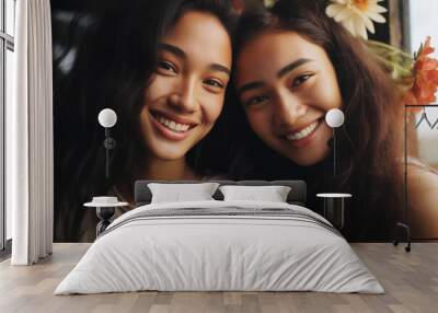 two young girls diversity smiling teenagers friends indoors with flowers happy casual tshirts warm light complicity bond friendship enjoying cheerful upbeat youth joy joyful Wall mural