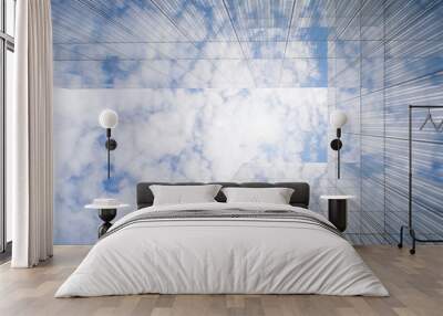 glass facade of a modern building reflecting clouds Wall mural