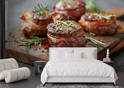 Modern style traditional fried dry aged angus beef filet medaillons natural wrapped with bacon and served on a wooden design board Wall mural