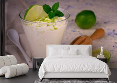 Lime mint dessert in a glass on a light background. Wall mural