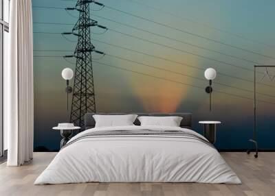 sunset in the plain, poles and wires for electricity Wall mural