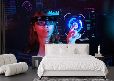 Business woman try vr glasses hololens in the dark room | Portrait of young asian girl experience ar communication | Future technology concept Wall mural