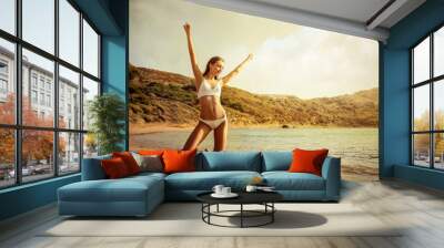 Happy girl at the beach Wall mural