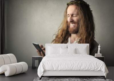 Jesus using a smartphone Wall mural