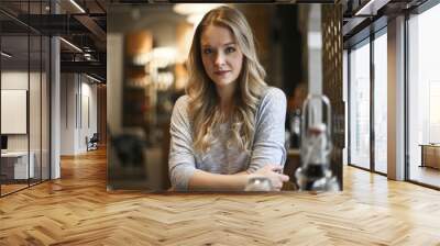 portrait of a young woman in  a restaurant Wall mural