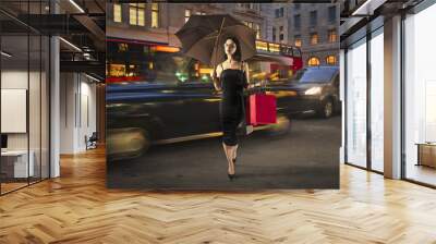 Sophisticated woman walking in the street Wall mural