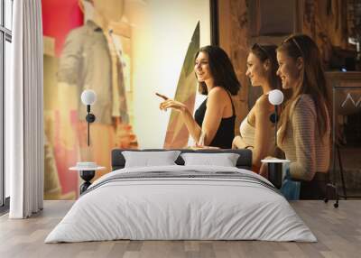 Three girls window shopping together Wall mural