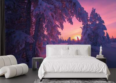 winter landscape with forest, cloudy sky and sun Wall mural