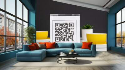 QR code for online menu service at table in restaurant New contactless technology lifestyle protect. Yellow mugs on a white table. Wall mural