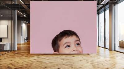 Little boy smiling on pink background
 Wall mural