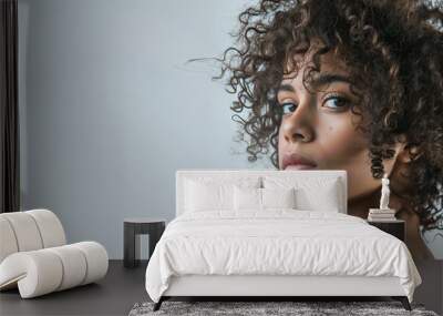 portrait of a woman with curly hair Wall mural