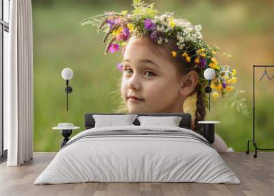  little girl in a wreath of wild flowers in summer Wall mural