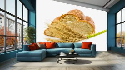 bun with sesame seeds and a bunch of ears of wheat isolated on a Wall mural