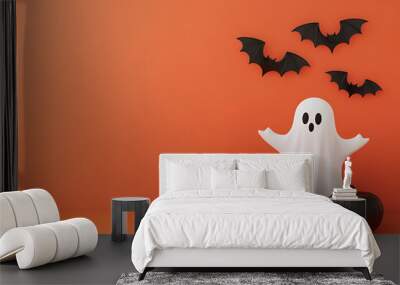 implicity Halloween background with a ghost, pumpkins and bats on orange back Wall mural