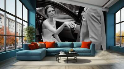 bride and groom with a black car Wall mural