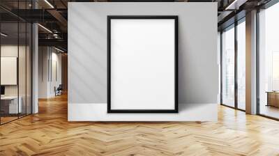 Mockup black frame photo on background wall with shadow. Mock up artwork picture framed. Vertical boarder. Empty board A4 photoframe. Modern 3d border for design prints poster, painting image. Vector Wall mural