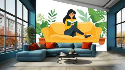 happy woman reading a book on the sofa Wall mural