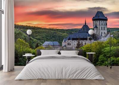 An orange twilight after sunset above the famous castle Karlstejn in Czech republic. Wall mural